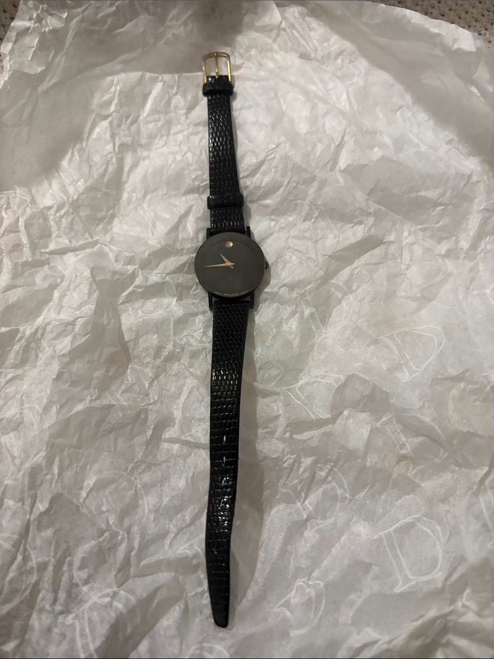 Movado Black Watch with Gold Hands